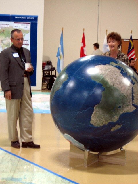 Hugh Constant discussing the detailed imagery globe with Ashley Gardner.