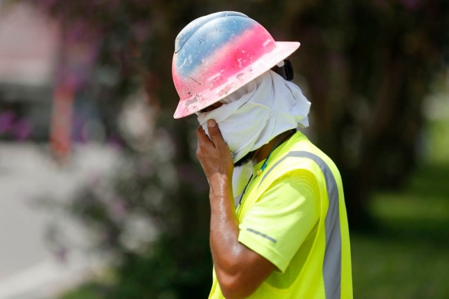 construction worker wiping sweat