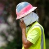 Construction Worker Wipes his Sweat